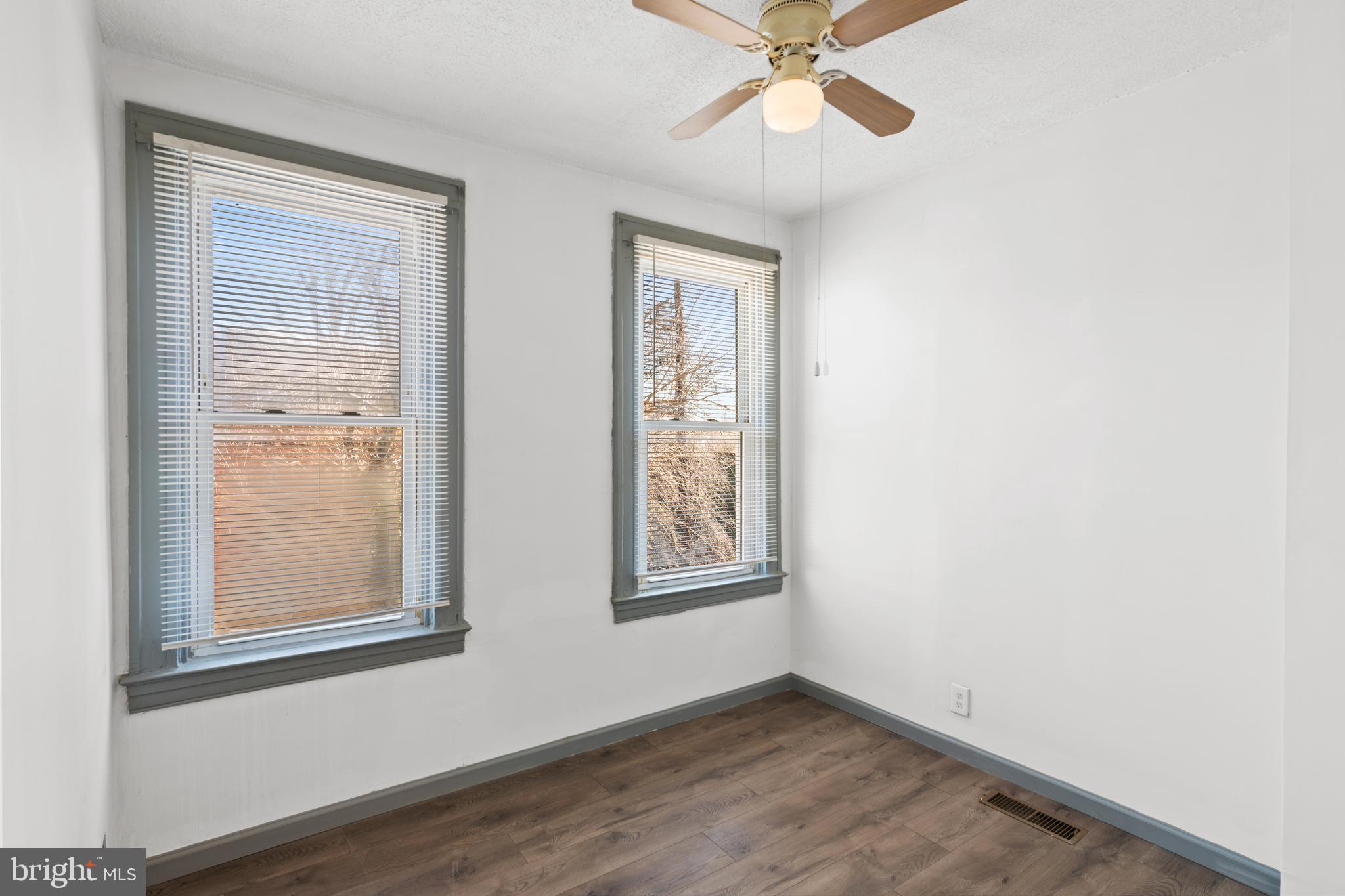 941 Brunswick Street Baltimore, MD 21223 - Photo 23 of 35 an empty room with windows and fan