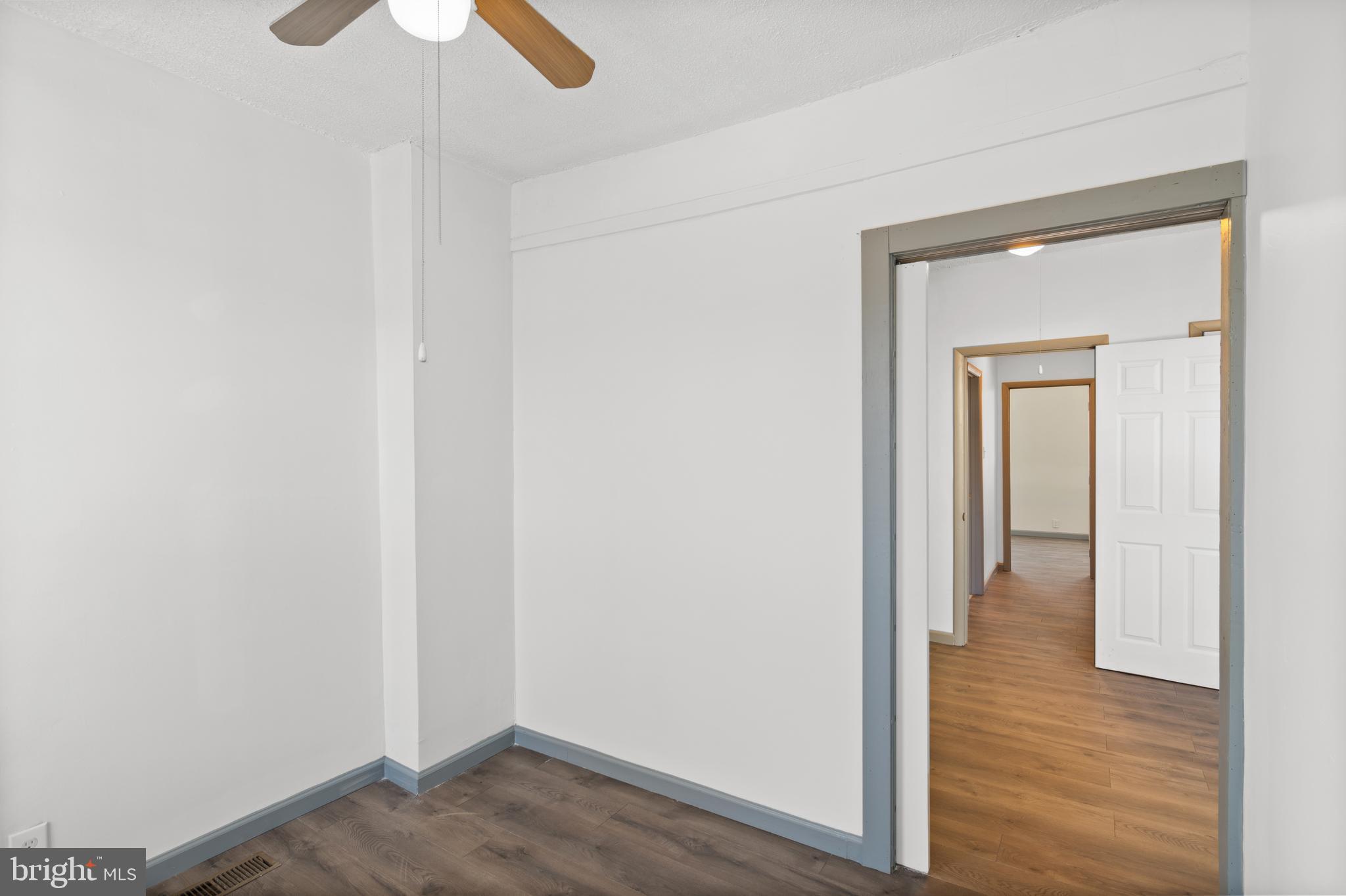 941 Brunswick Street Baltimore, MD 21223 - Photo 24 of 35 a view of a hallway with wooden floor