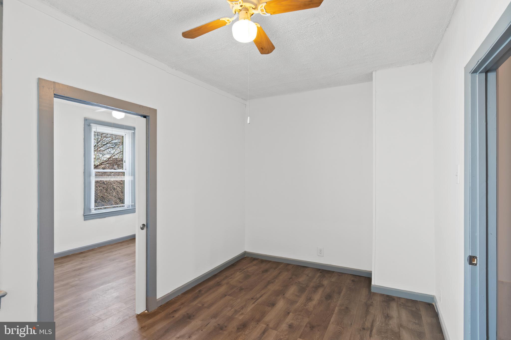 941 Brunswick Street Baltimore, MD 21223 - Photo 26 of 35 an empty room with windows and cabinet