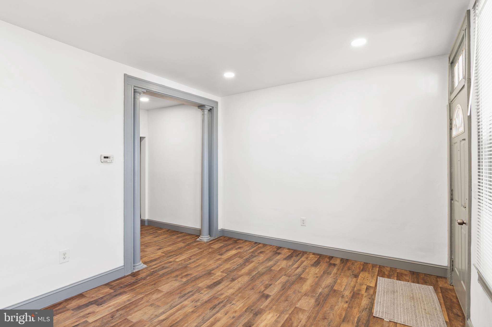 941 Brunswick Street Baltimore, MD 21223 - Photo 4 of 35 an empty room with wooden floor and closet