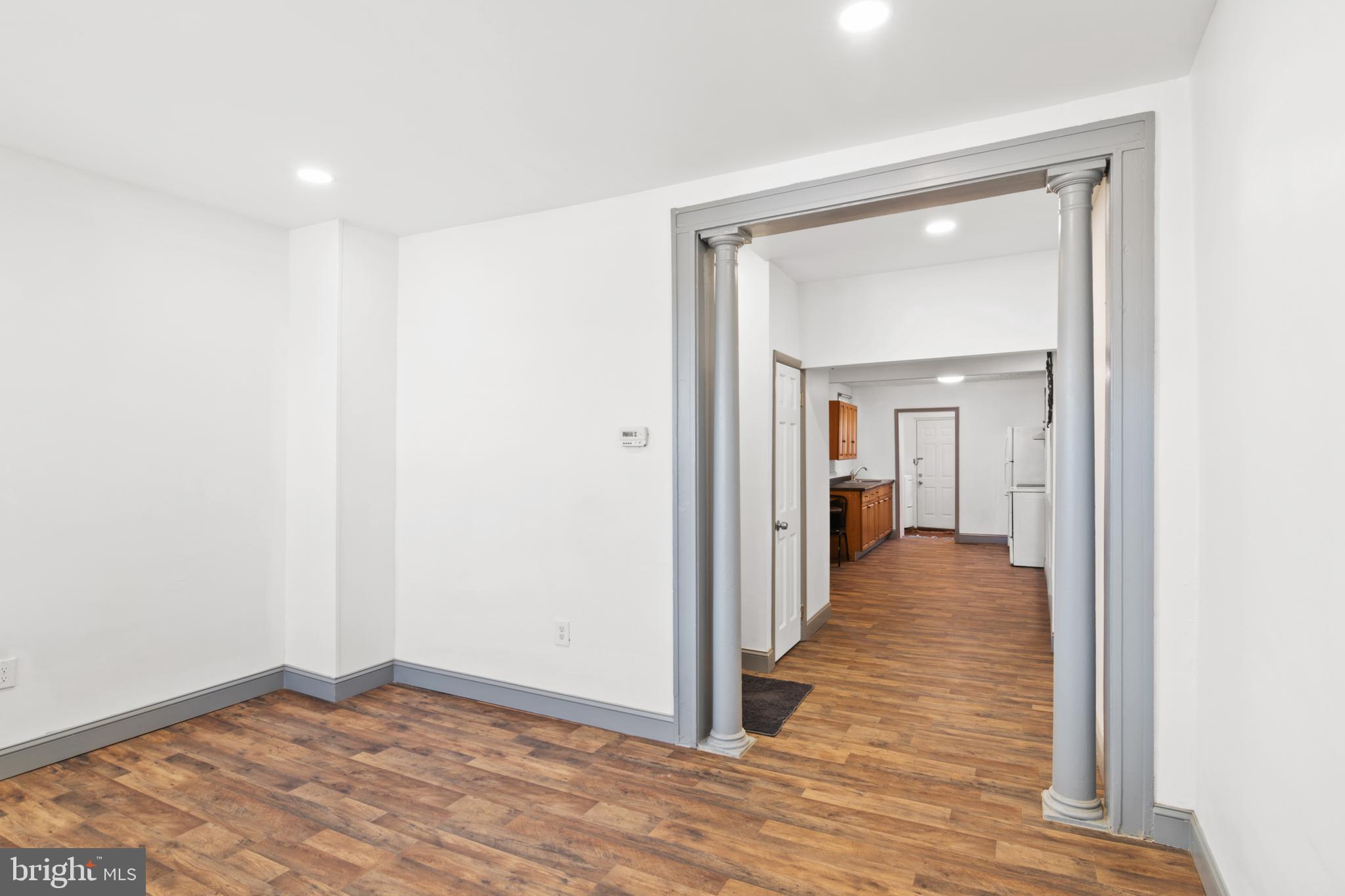 941 Brunswick Street Baltimore, MD 21223 - Photo 5 of 35 a view of a hallway with wooden floor