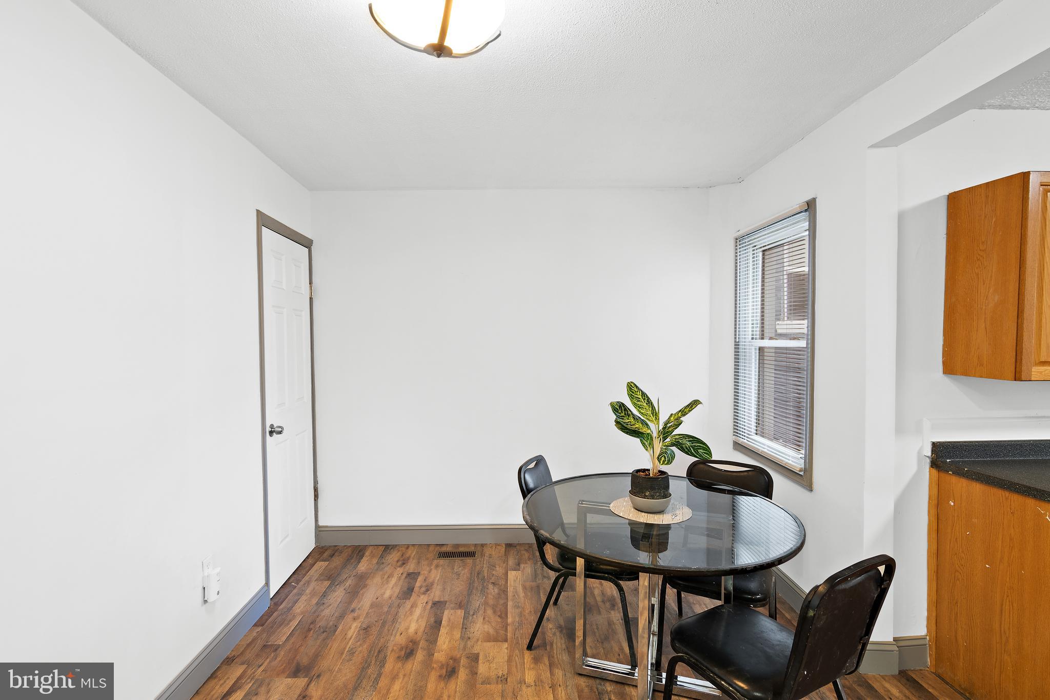 941 Brunswick Street Baltimore, MD 21223 - Photo 9 of 35 a view of a workspace with furniture and wooden floor