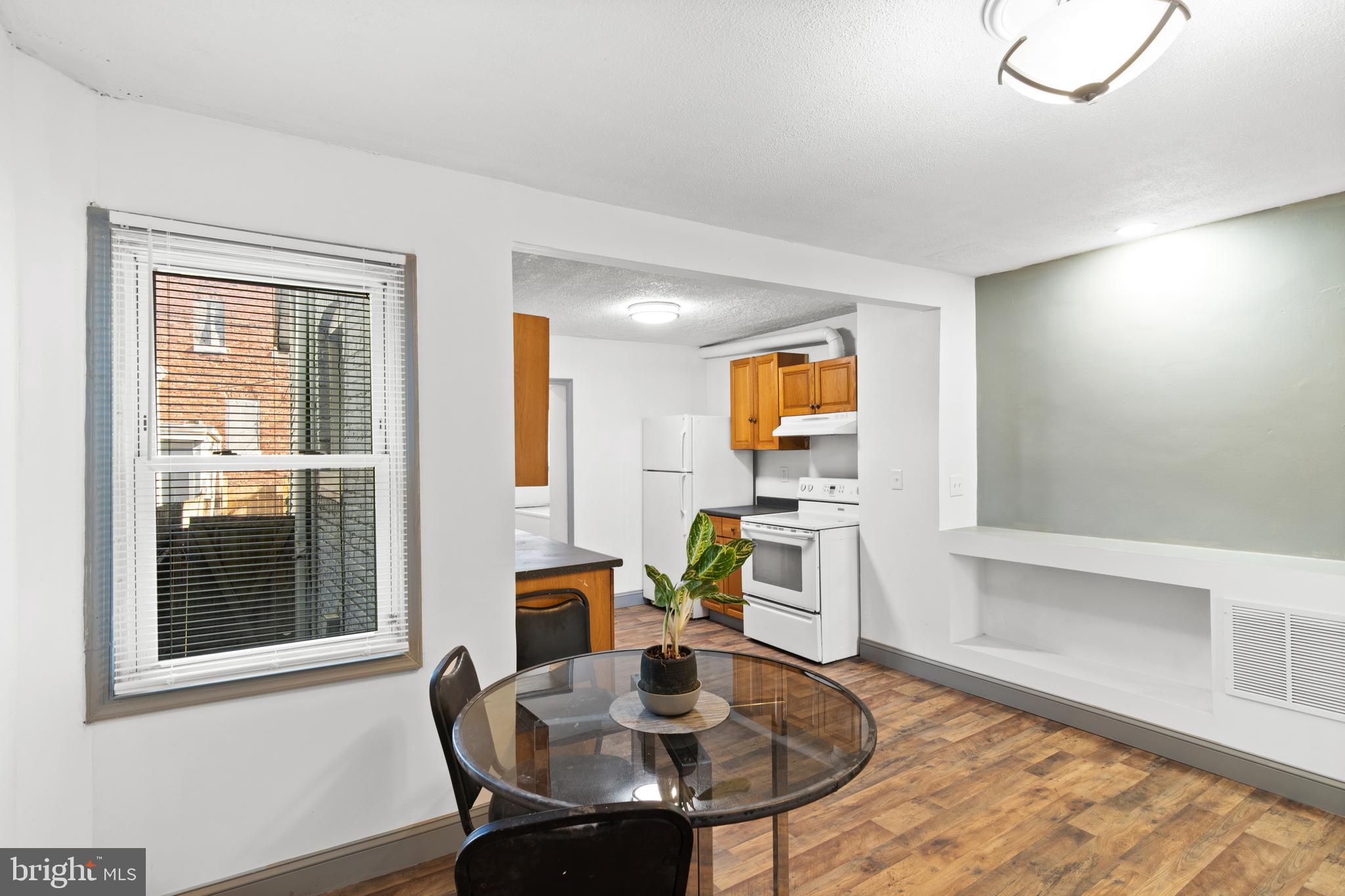 941 Brunswick Street Baltimore, MD 21223 - Photo 10 of 35 a dining room with furniture and window