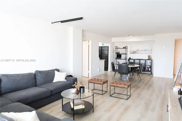 a living room with furniture and a table