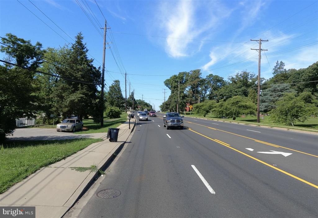 a couple of cars parked on the side of a road