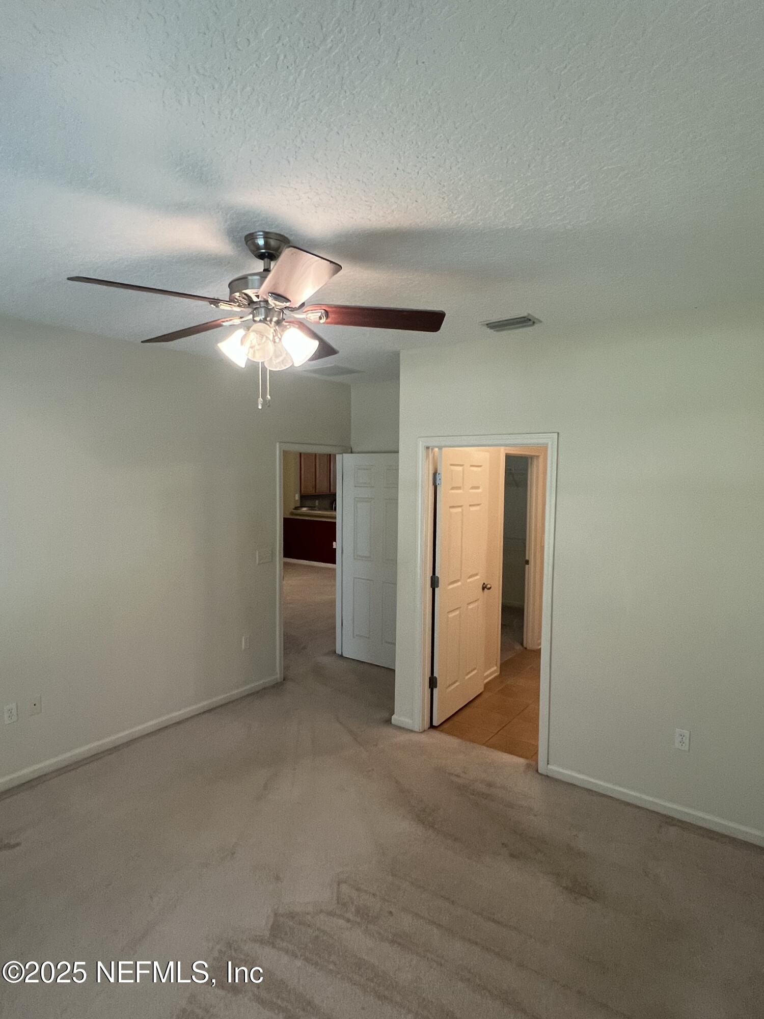 5663 Greenland Road, Unit 1706 Jacksonville, FL 32258 - Photo 4 of 11 wooden floor in an empty room