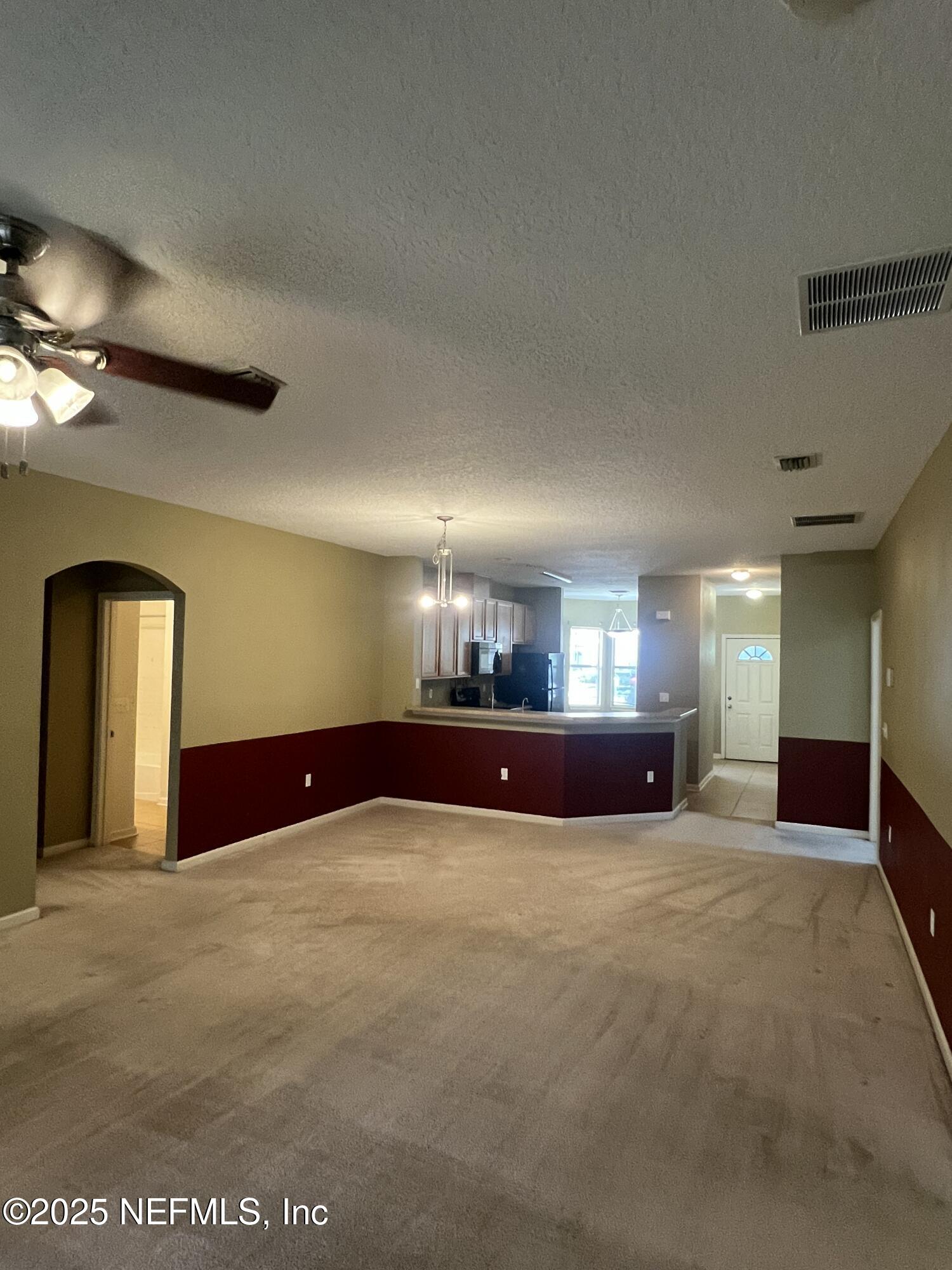 5663 Greenland Road, Unit 1706 Jacksonville, FL 32258 - Photo 7 of 11 a view of an empty room with a window