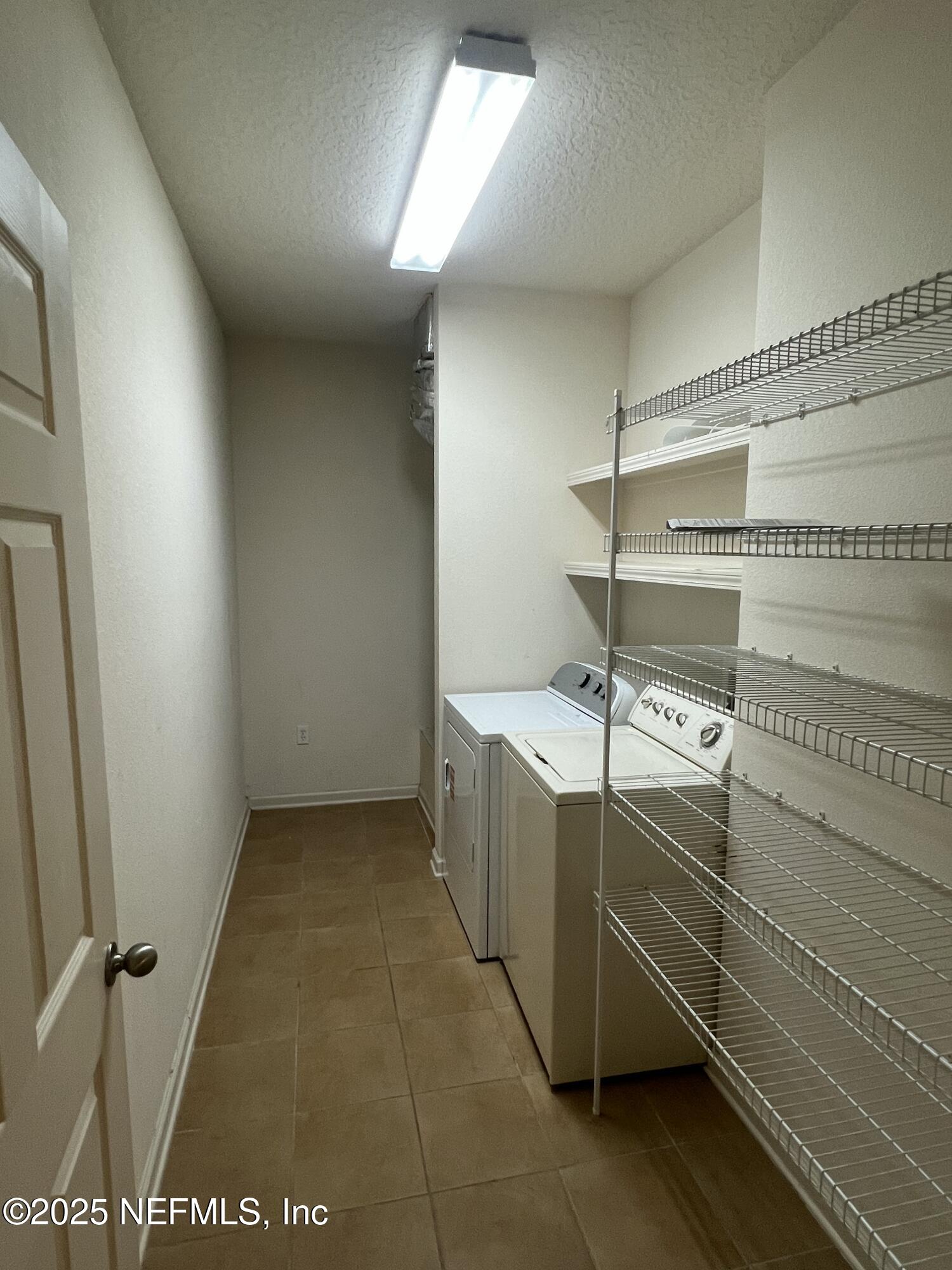 5663 Greenland Road, Unit 1706 Jacksonville, FL 32258 - Photo 10 of 11 a view of storage and utility room