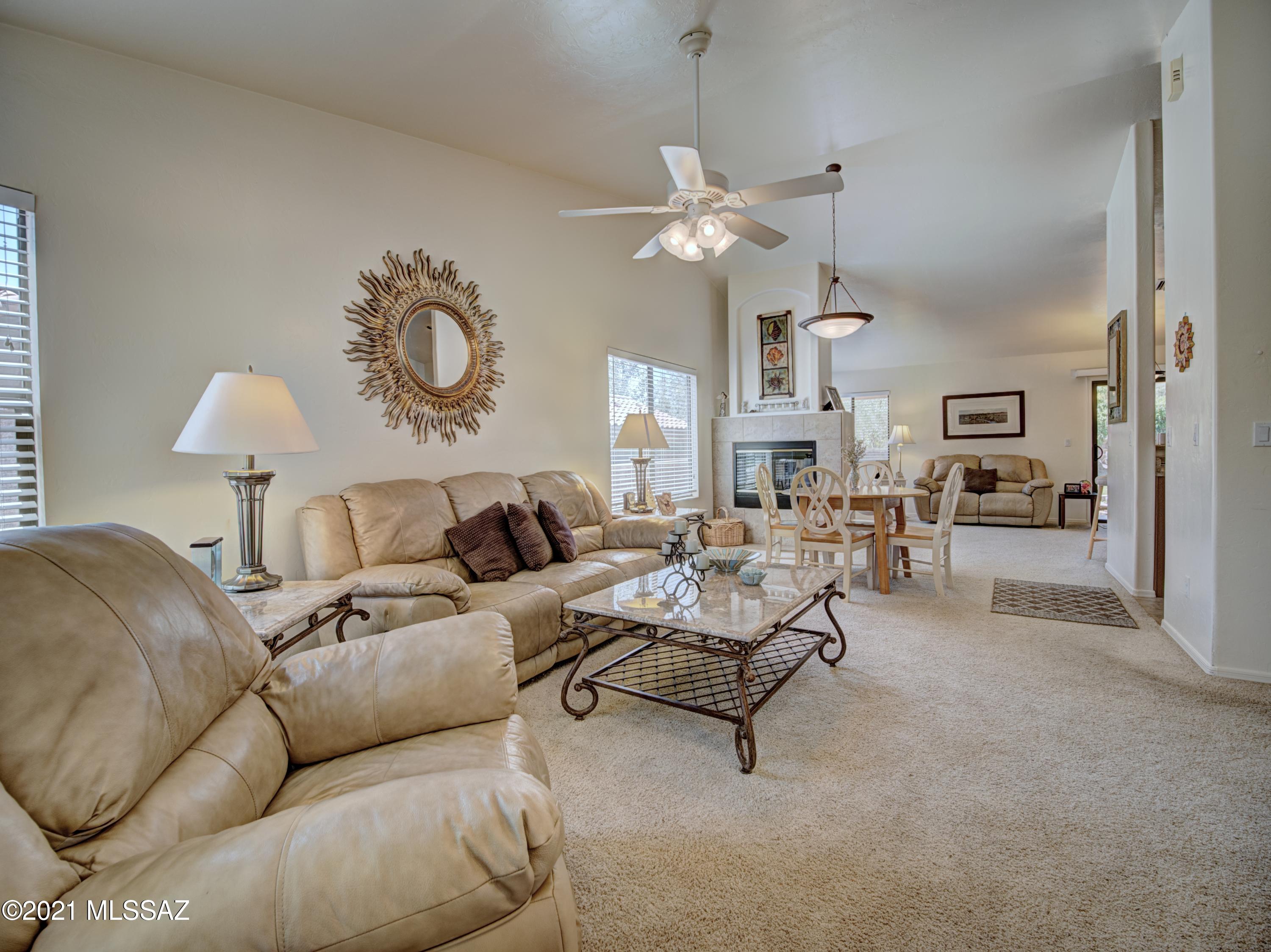 434 Colorado Court Rio Rico, AZ 85648 - Photo 6 of 29 a living room with furniture and a chandelier