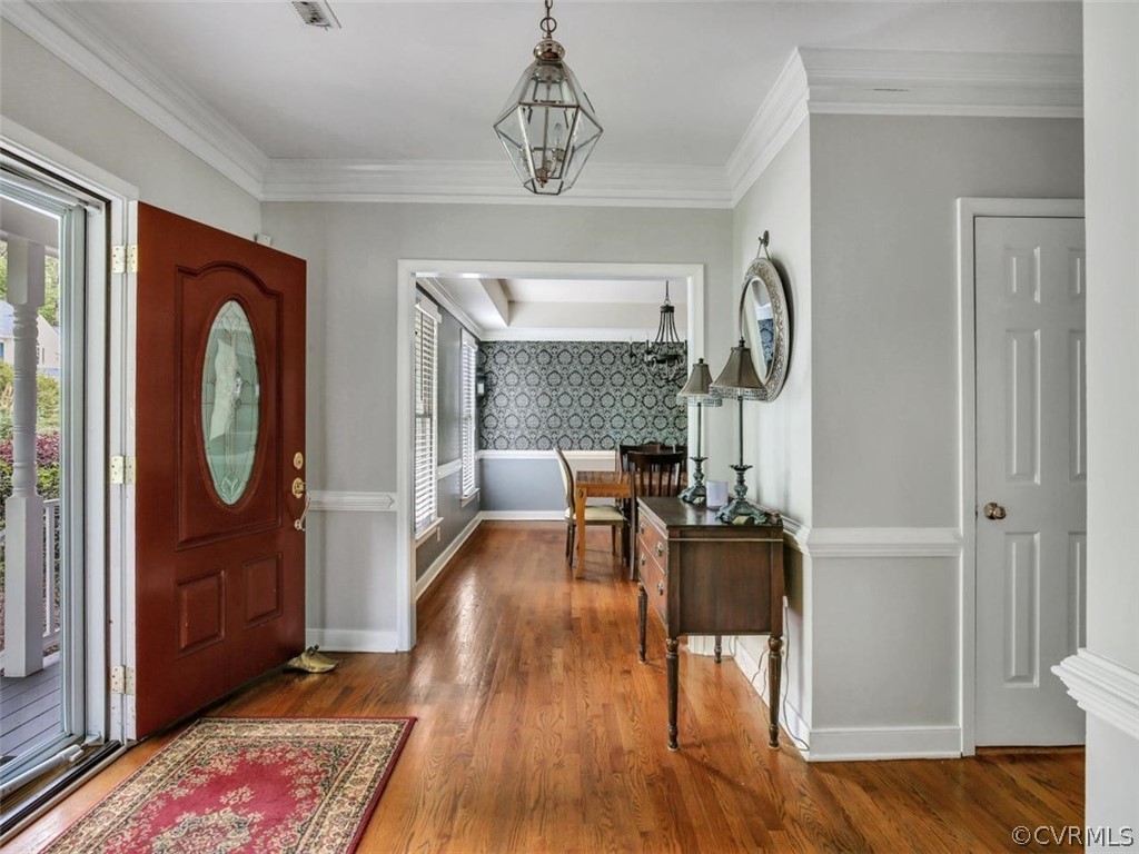 14404 Huntgate Woods Road Midlothian, VA 23112 - Photo 4 of 41 Large foyer with wood floors, chair rail and crown