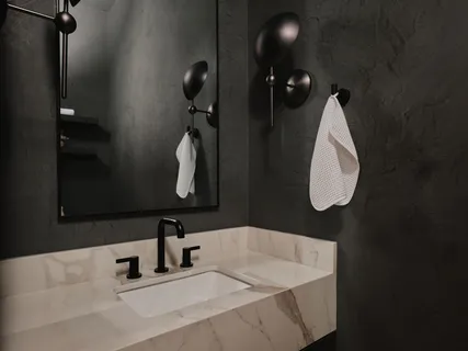 a bathroom with a sink and mirror