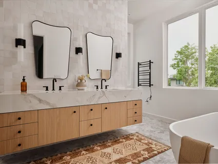 a spacious bathroom with a double vanity sink and a mirror