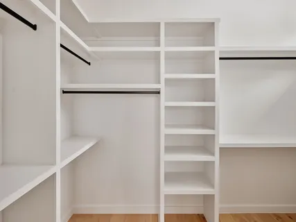 a view of an empty walk in closet