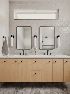 a bathroom with mirror a sink and a mirror