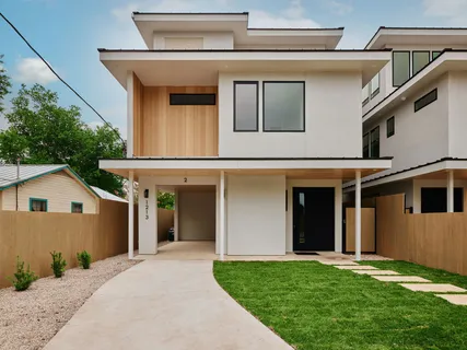 a view of a house with a yard and sitting space