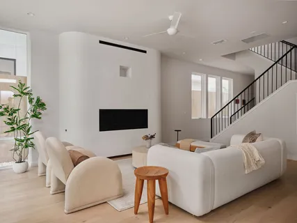 a bedroom with furniture and a flat screen tv