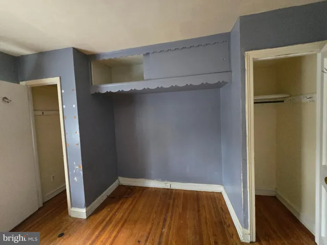 a front view of a house with parking space