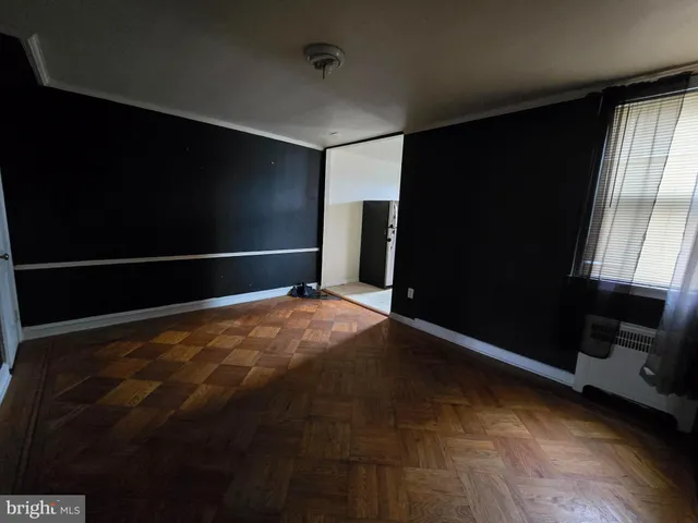 a view of empty room with window and stairs