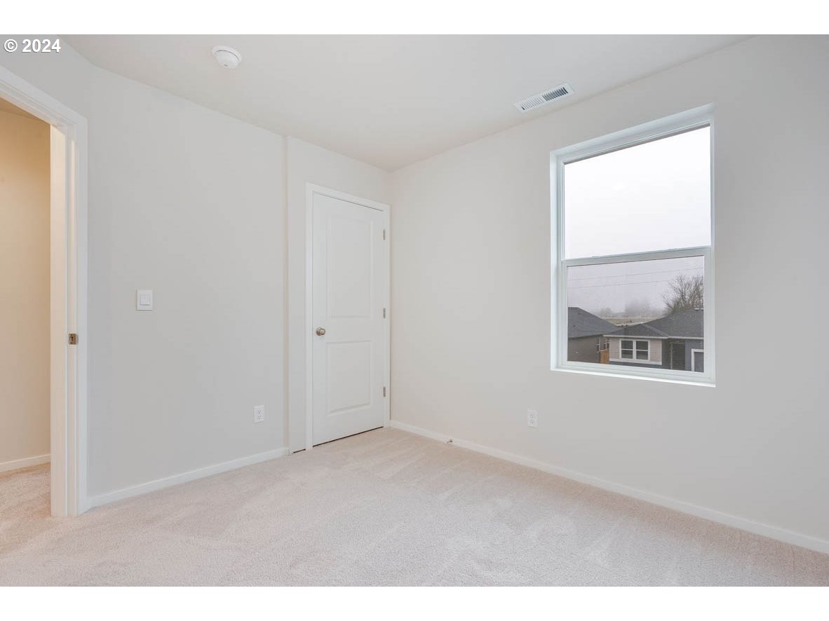 2998 U Street Springfield, OR 97477 - Photo 9 of 16 a view of an empty room with a window