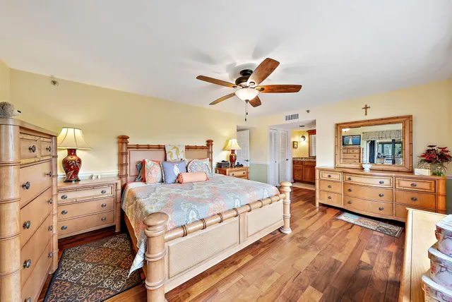 a bed room with a bed and a chandelier