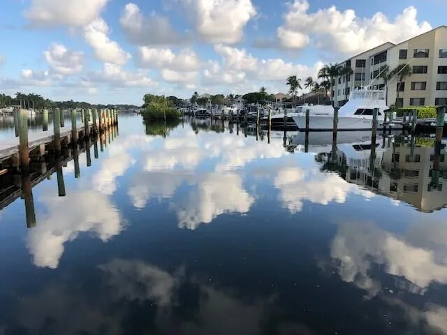 a view of a lake with a table and chairs