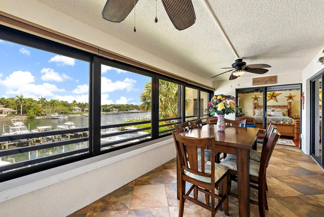a dining room with furniture window and wooden floor