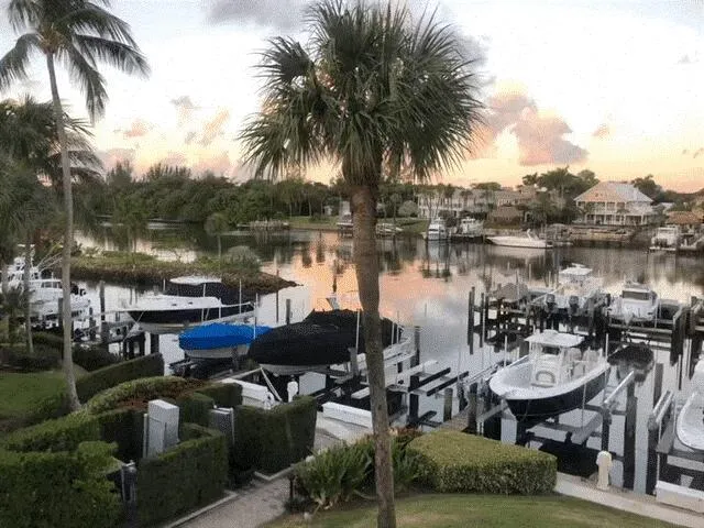 a view of a lake with outdoor seating space