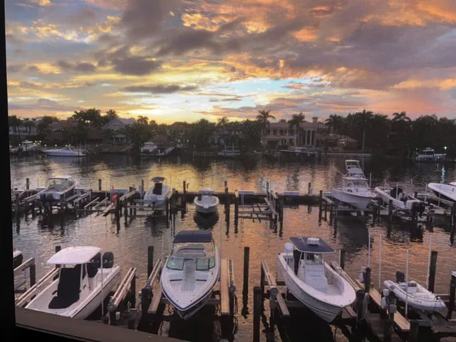 an aerial view of a house with a yard basket ball court and outdoor seating