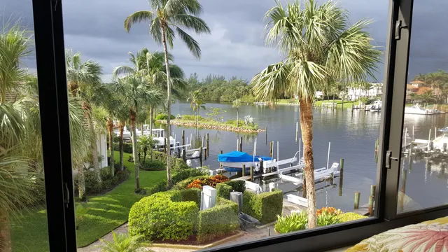 an aerial view of a house with a lake view