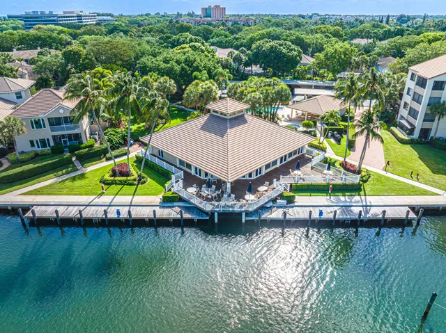 an aerial view of a house with a lake view