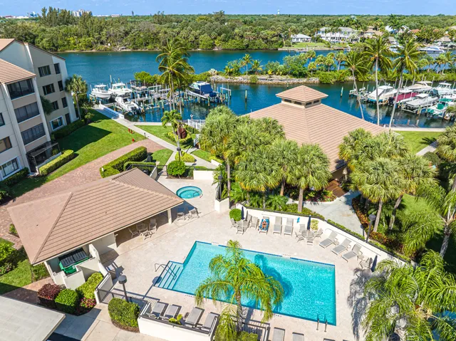 a view of a patio with a table chairs and a table