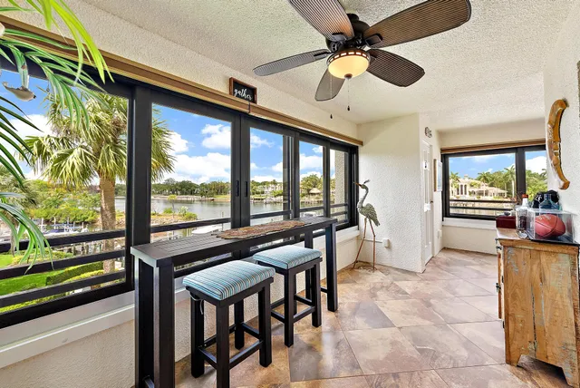 a view of a livingroom with furniture and a ceiling fan