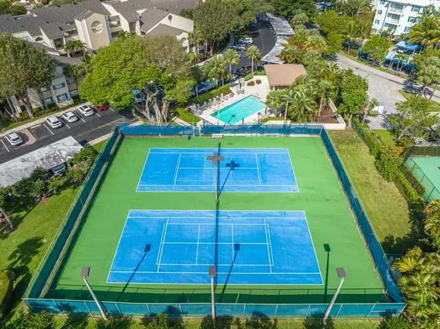 an aerial view of residential houses with outdoor space