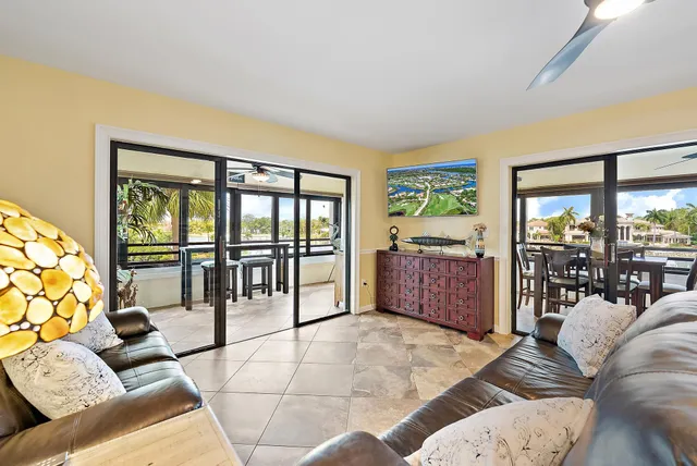 a living room with furniture and a large window with outer view