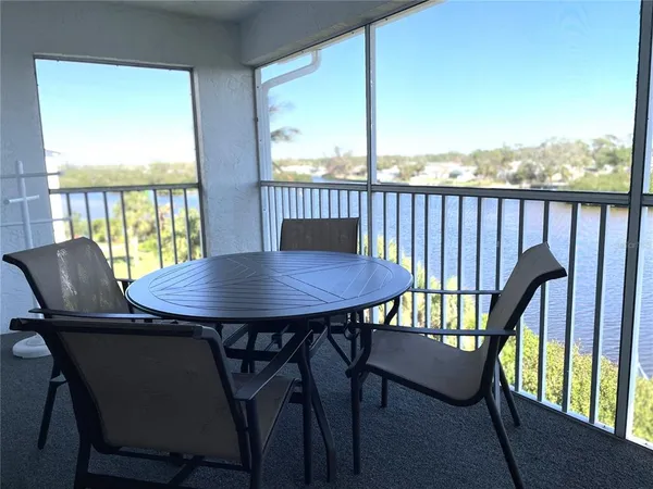 a view of a city from a dining room with furniture window and outside view