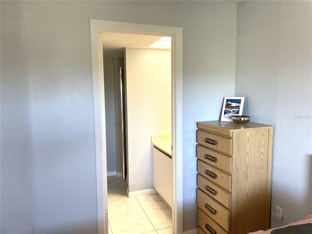 1401 South McCall Road, Unit 301A Englewood, FL 34223 - Photo 17 of 22 a view of walk in closet with window