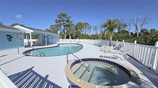 a view of a swimming pool with a patio