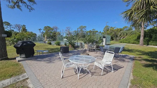 a view of a chairs and table in the patio