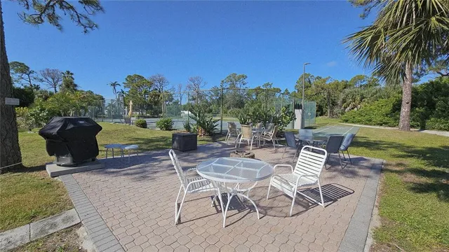 a view of a chairs and table in the patio