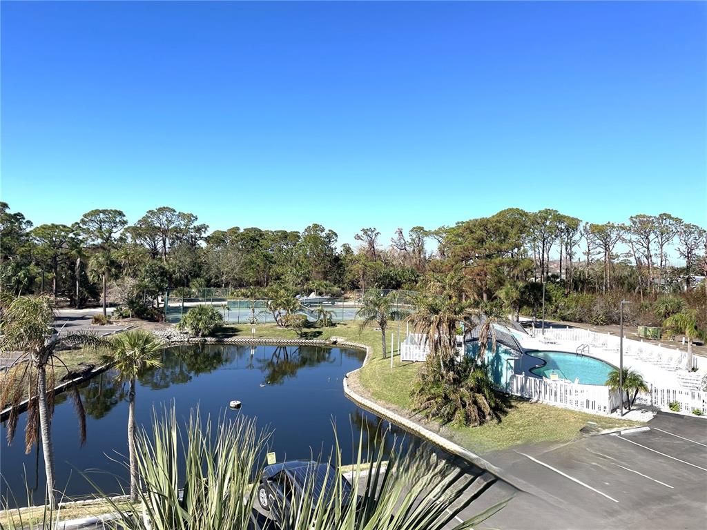 1401 South McCall Road, Unit 301A Englewood, FL 34223 - Photo 22 of 22 a view of a lake with a mountain view
