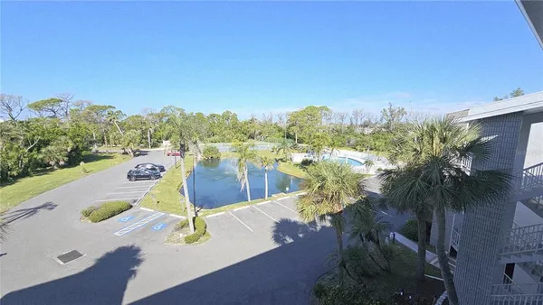 a view of a swimming pool with a yard
