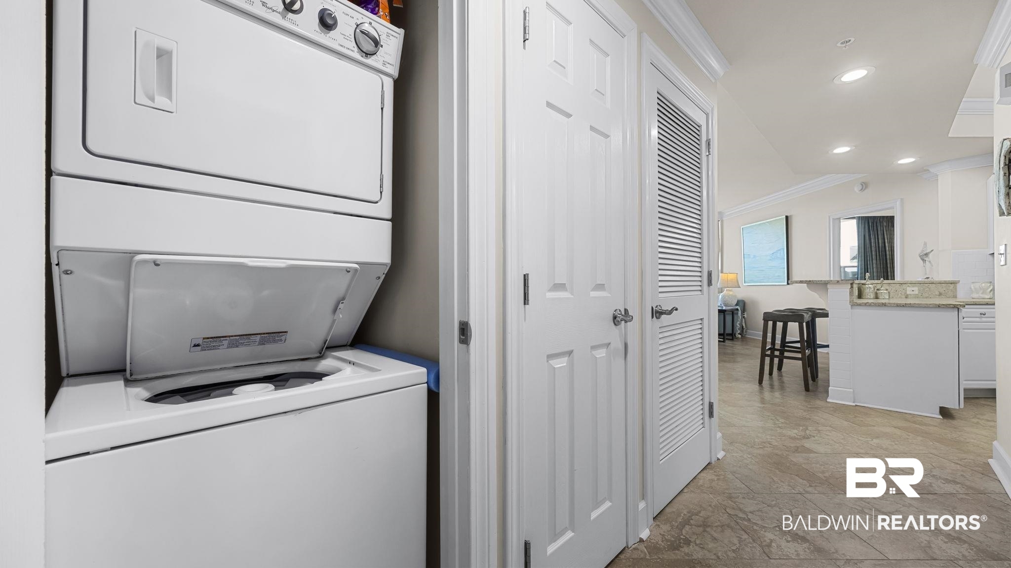 27580 Canal Road, Unit 1526 Orange Beach, AL 36561 - Photo 19 of 49 Washroom featuring stacked washer / drying machine, crown molding, and recessed lighting