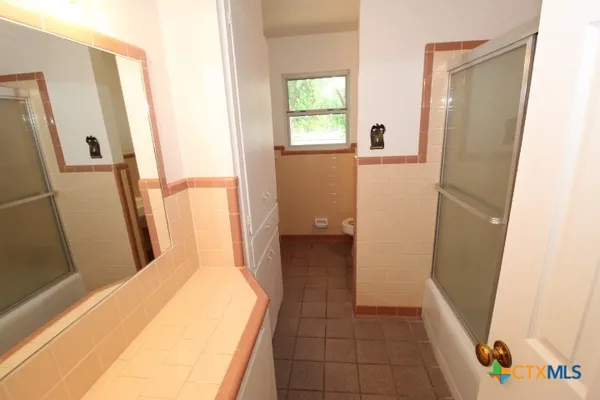 a bathroom with a sink and a toilet