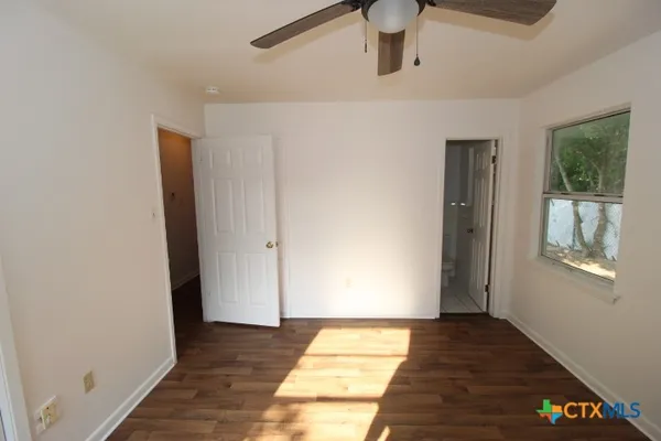 a view of an empty room and window