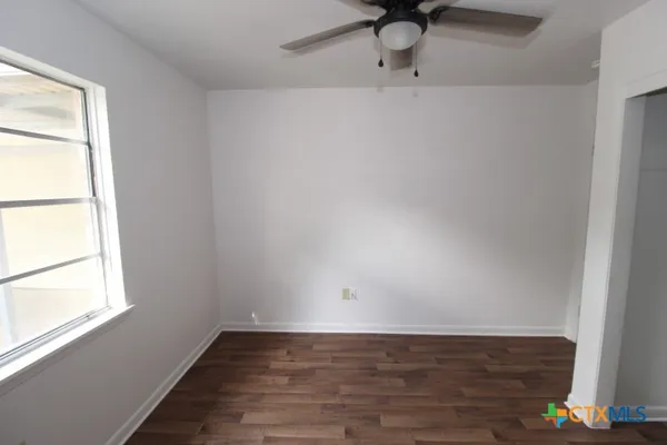 a view of an empty room and window