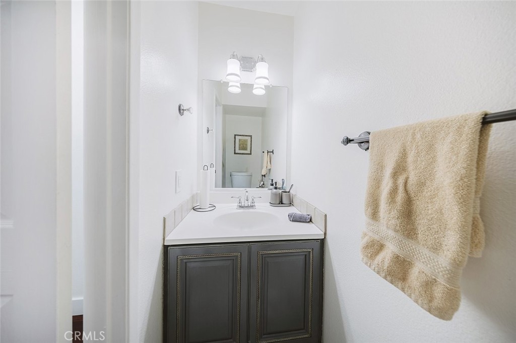 9775 Vía Roma Burbank, CA 91504 - Photo 16 of 39 a bathroom with a sink a mirror and a shower