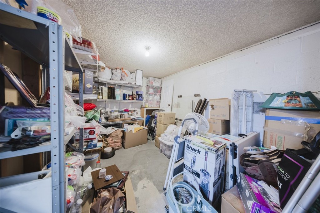 9775 Vía Roma Burbank, CA 91504 - Photo 19 of 39 a room with furniture and a flat screen tv