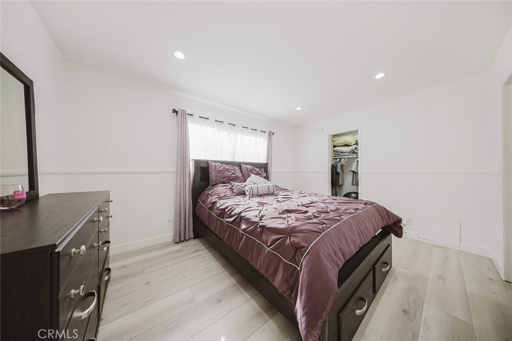 9775 Vía Roma Burbank, CA 91504 - Photo 22 of 39 a bedroom with a bed and a flat screen tv