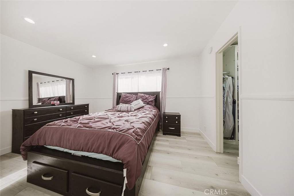 9775 Vía Roma Burbank, CA 91504 - Photo 23 of 39 a bedroom with a bed and a flat screen tv