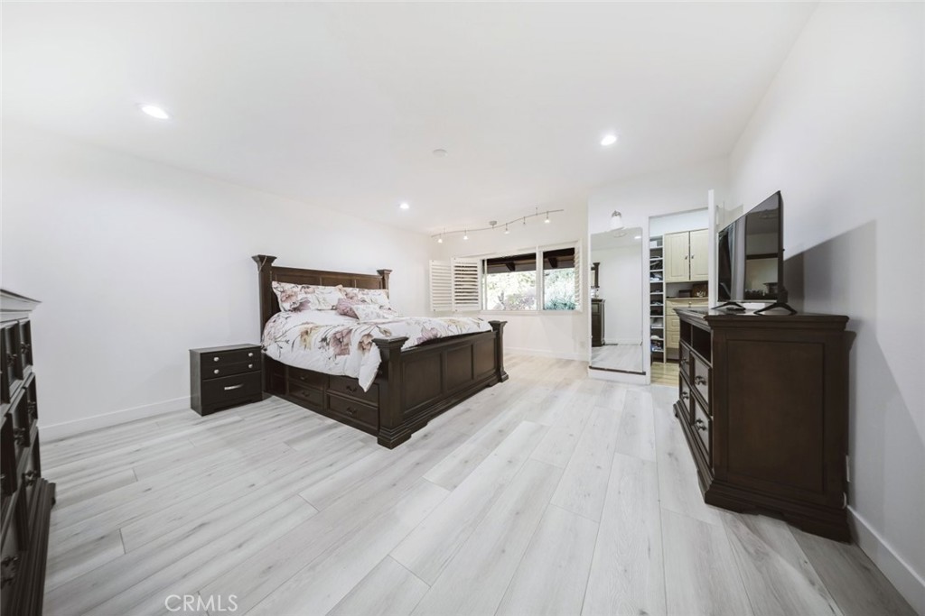 9775 Vía Roma Burbank, CA 91504 - Photo 29 of 39 a living room with furniture and a flat screen tv